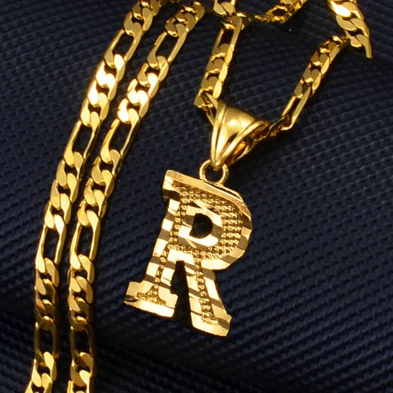 Gold plated initial letter pendant necklace with Figaro chain for women, men, and girls.