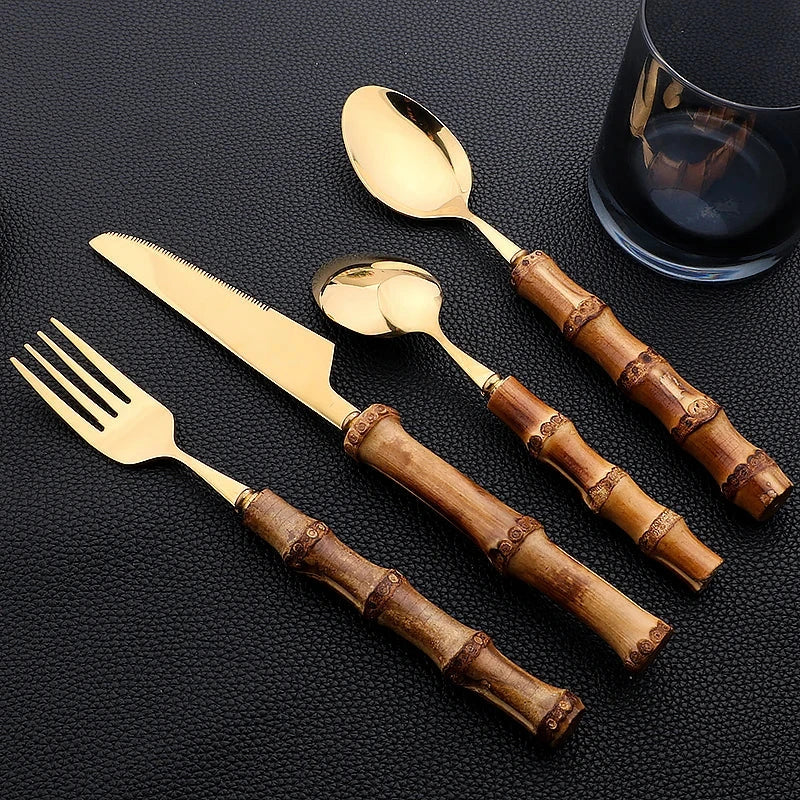 Luxury bamboo handle stainless steel dinnerware set with knife, fork, spoon, and cutlery rack.