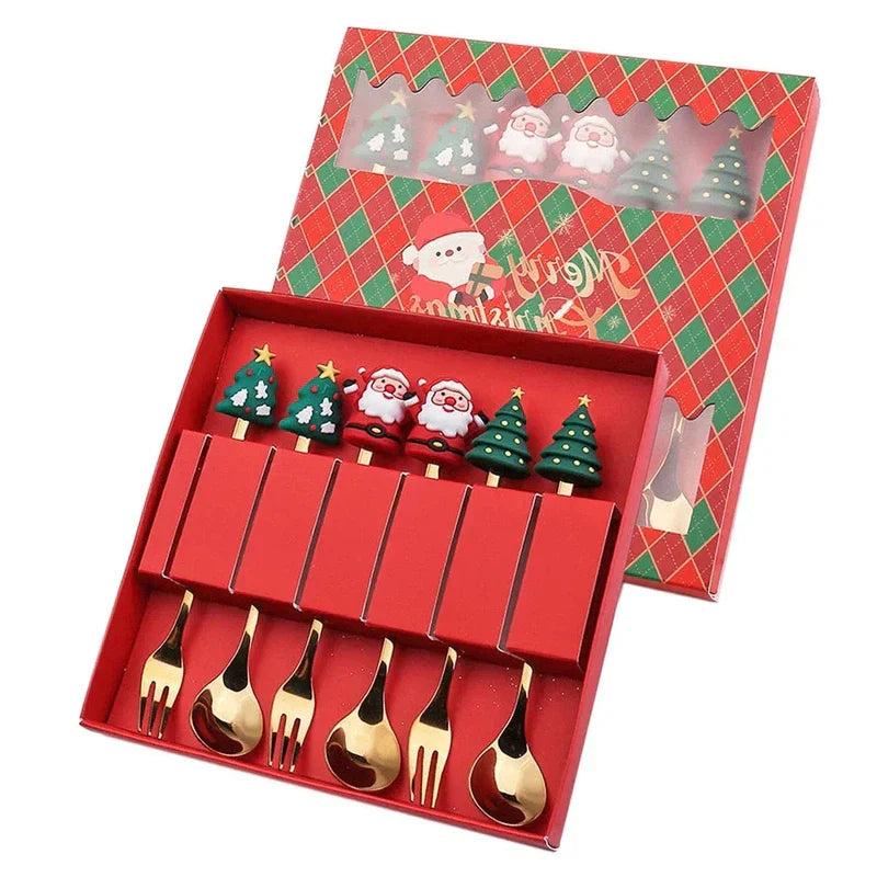 Christmas-themed gold spoon and fork set with elk and tree decorations in a festive red box.