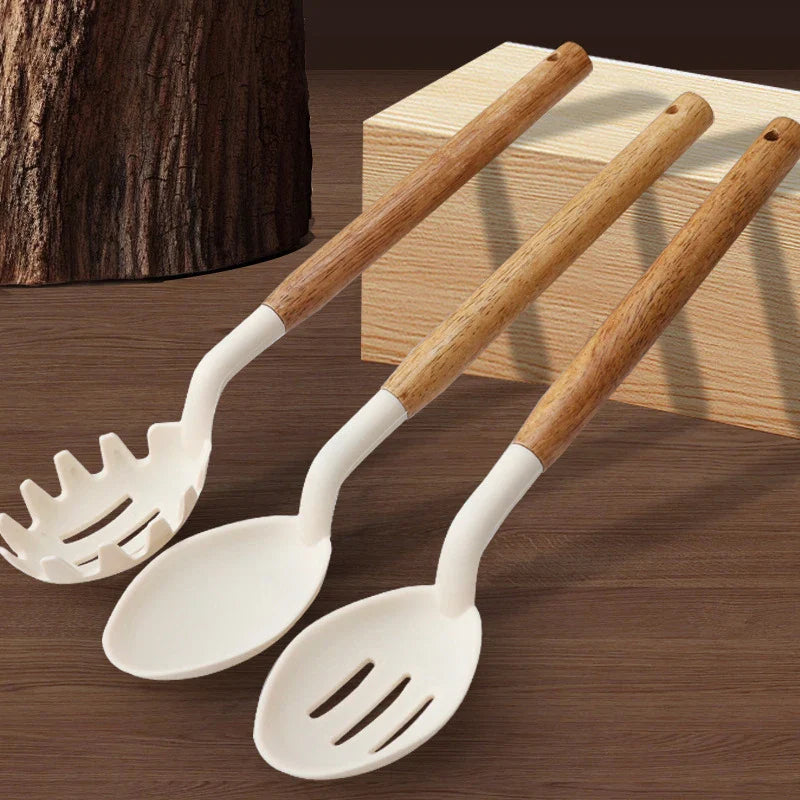 11Pcs silicone cooking utensils set with wooden handles featuring spatula and slotted spoon.