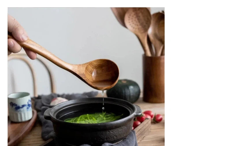 Wooden kitchen utensils set with soup spoon over pot.