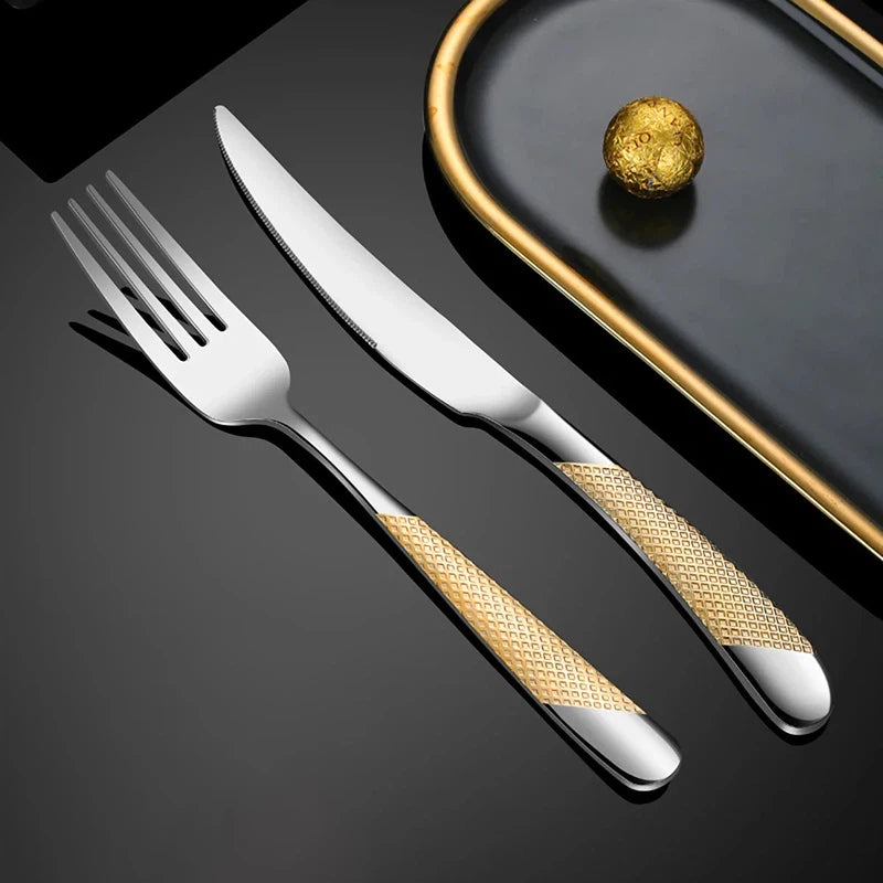 Stainless steel fork and knife set from 24-piece tableware collection, featuring a modern design on a black background.