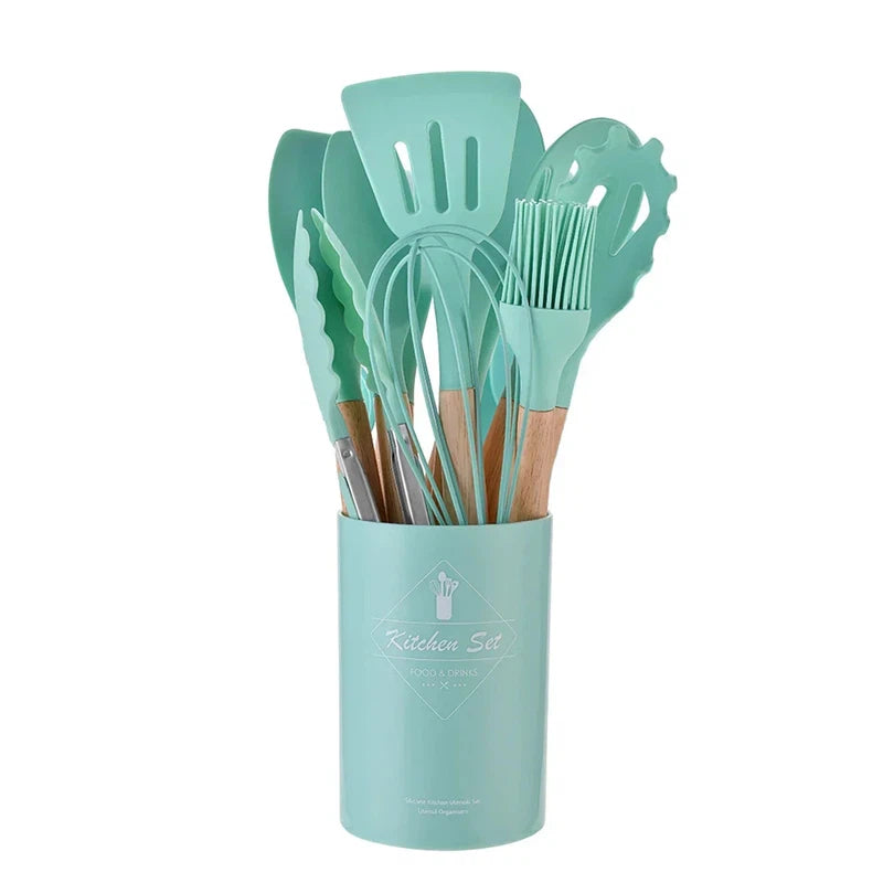 12-piece silicone kitchen utensil set with wooden handles and storage bucket in teal, heat resistant and non-stick.