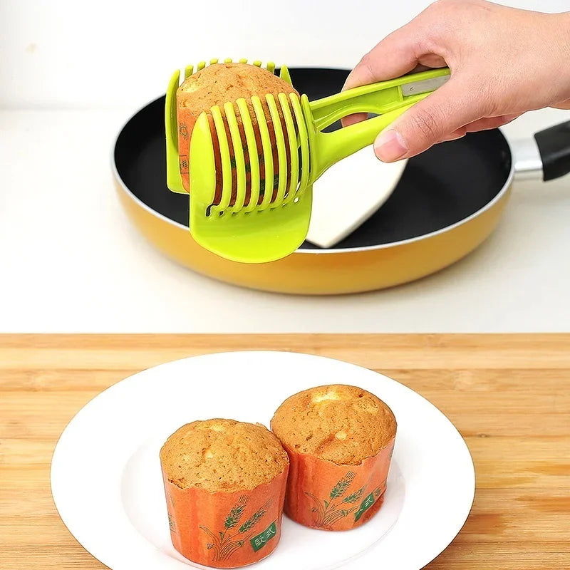 Stainless steel handheld slicer for oranges, lemons, and tomatoes; kitchen tool for easy slicing.