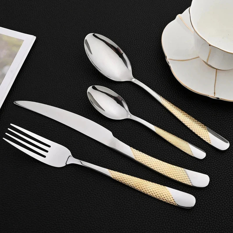 24-piece stainless steel tableware set with knives, forks, and spoons on a black surface; mirror finish, dishwasher safe.