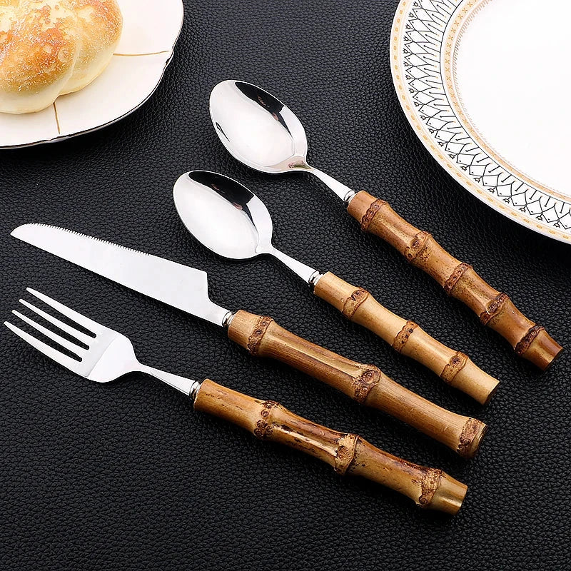 6//24Pcs luxury dinnerware set with bamboo handles, stainless steel knife, fork, spoon, and cutlery rack.