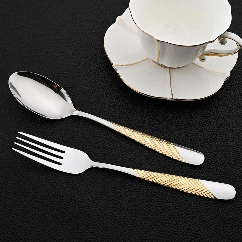 24-piece stainless steel dinnerware set with knife, fork, spoon, and teacup on black background.