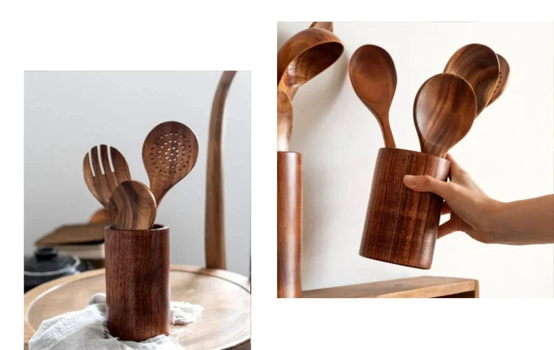 Wooden kitchen utensils set with wooden handles, including a soup spoon, spatula, and rice spoon, in a holder on a wooden table.