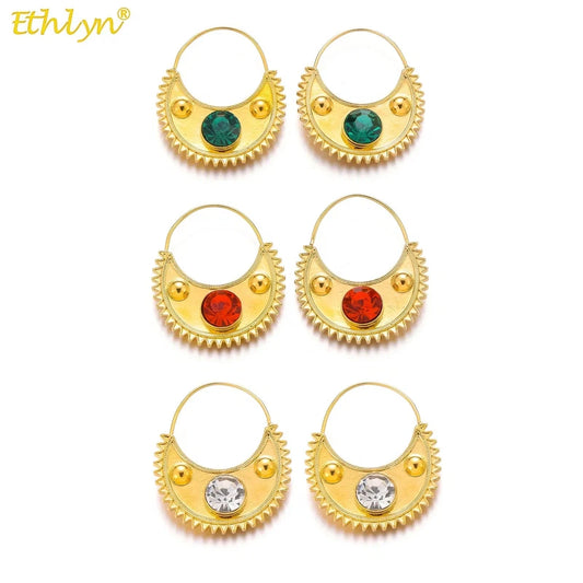 Gold color Ethiopian zircon clip earrings with round pattern for women.