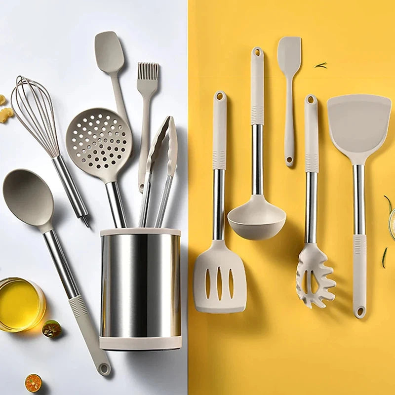 Silicone kitchenware set with rotating storage bucket and stainless steel eggbeater on a yellow background.