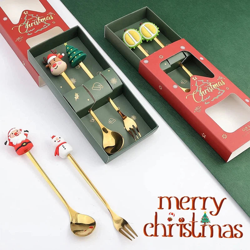 Christmas-themed stainless steel spoon and fork set in festive red and green boxes, perfect as kid-friendly Christmas gifts.