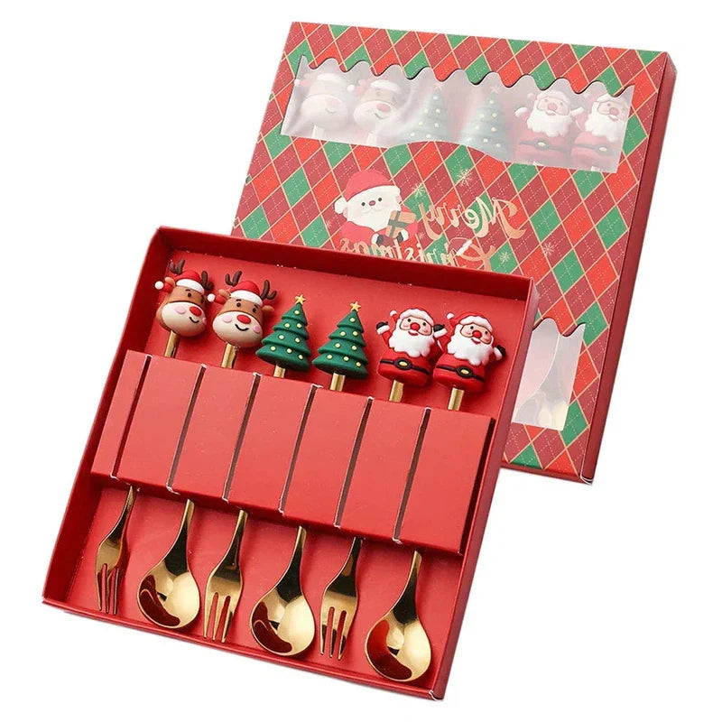 Christmas gift gold spoon and fork set with elk and tree decorations in red box.